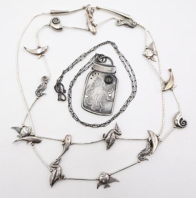 Two Nautical Charm and Octopus Necklaces: Marked Sterling silver sea creature charm necklace, and octopus in a jar necklace (not marked, but nonmagnetic)