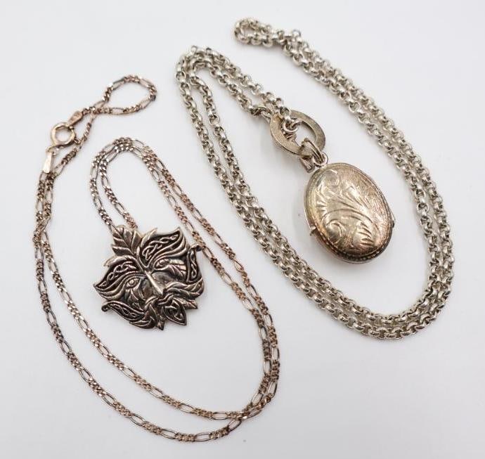 Two Sterling Silver Celtic Green Man and Locket Necklaces: 925 marked Celtic green man pendant and 925 marked chain, and vintage 925 marked locket with etching on one side and black glass on the other on a 925 chain