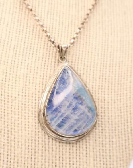 Lovely Moonstone Sterling Silver Necklace: Over an inch long lovely moonstone teardrop shaped pendant encased in 925 silver marked back, on 925 marked chain