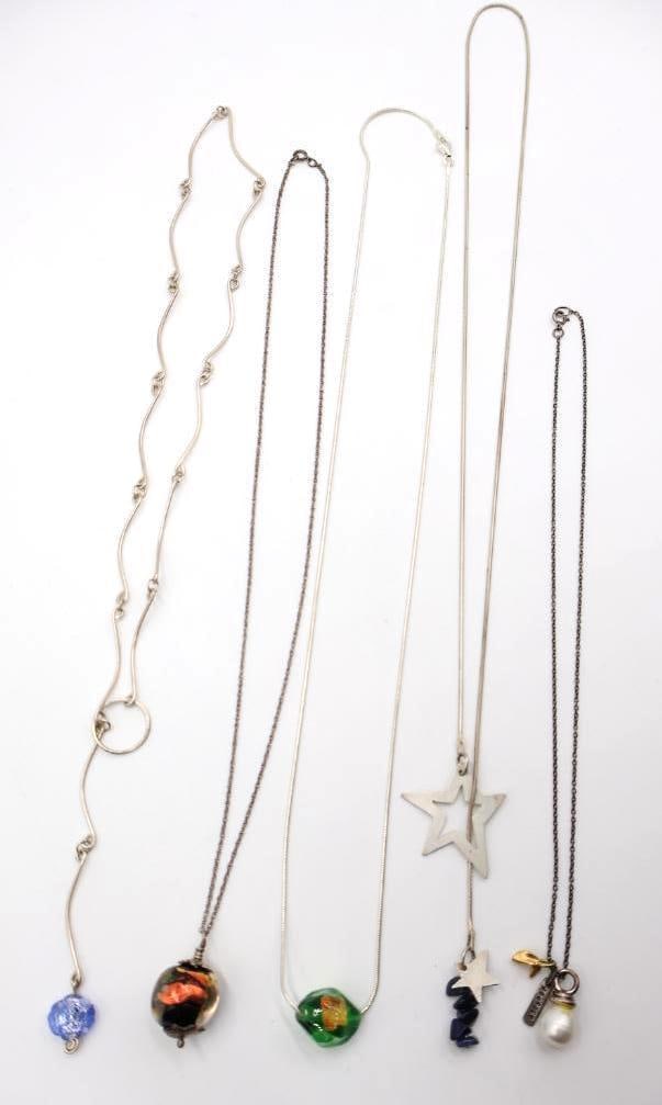 Five Necklaces, Some Sterling Silver Chains: Four marked either 925 or sterling, choker with glass blue bead unmarked but nonmagnetic