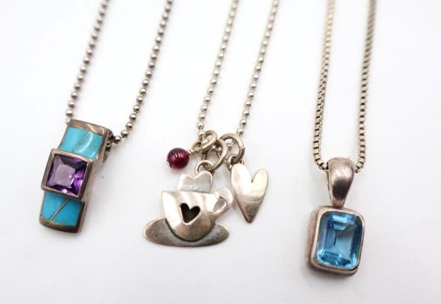 Three Sterling Silver Necklaces and Pendants: Amethyst pendant marked AK Sterling, chains also all marked