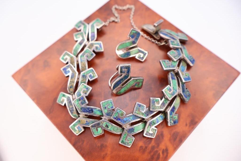 Mixed Vintage Bracelet Collection: Group of vintage bracelets featuring costume jewelry and silver tone pieces in assorted patterns and designs.