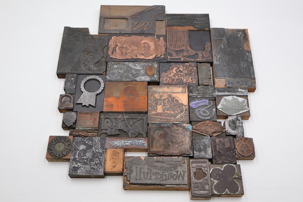 Assorted Vintage Printing Plates, Engraving Blocks & Decorative Letterpress Cuts: Eclectic collection of vintage printing plates, copper engravings, and letterpress blocks featuring decorative borders, figurative scenes, typography, advertising imagery, florals, and ornate graphic