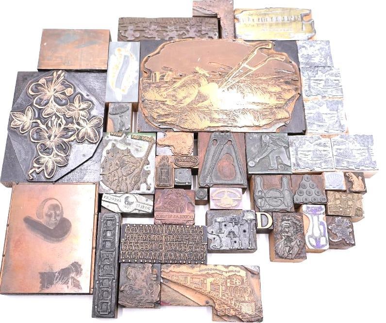 Vintage Letterpress Printing Blocks, Assorted Copper & Wood Cuts: The assortment displays a diverse variety of historical subject matter, featuring detailed illustrations such as a large farming scene with a horse-drawn plow, botanical floral arrangements, a portrai