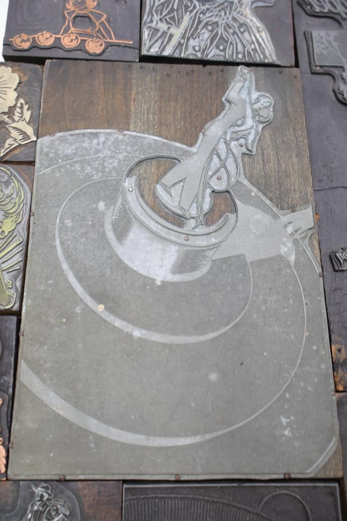 Collection of vintage letterpress printer's blocks made from wood and etched metal - 18