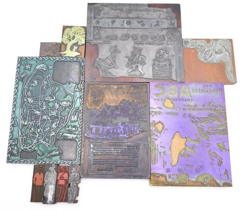 Collection of vintage letterpress printing blocks featuring various designs: These are vintage letterpress printing blocks featuring military figures and stylized clothing patterns, and more.