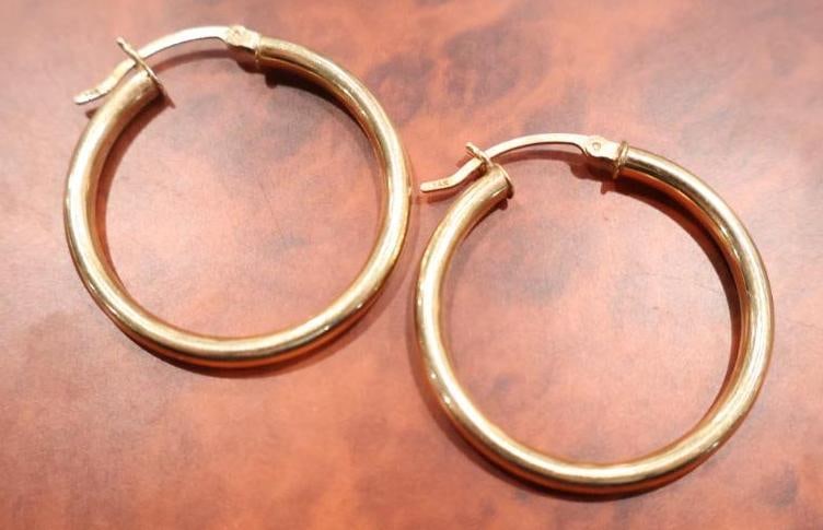 Pair of 14k Gold Hoop Earrings: Pair of yellow gold hoop earrings marked 14k, weighing about 4.23 grams