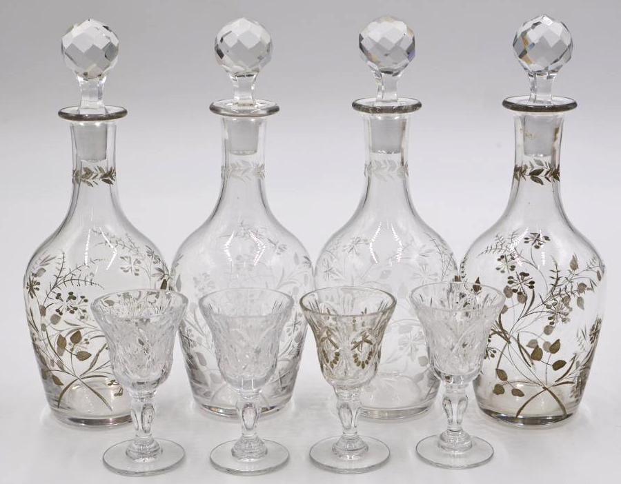 Two Pairs of Ornate Stoppered Vessels and Four Small Apretief Cups: One pair of stoppered decanters with gold leaf design, and the other just etched glass. One cup has gilding