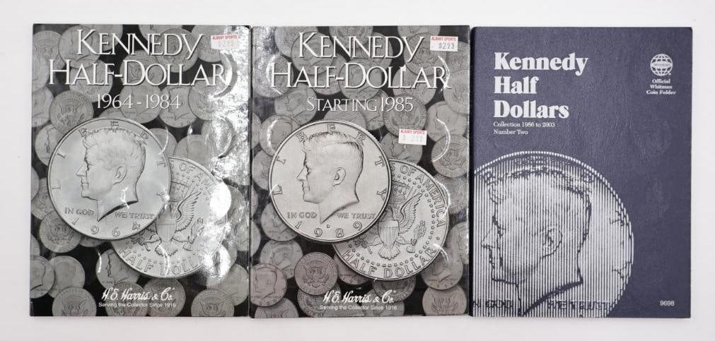 Three Kennedy Half Dollar Coin Folders, Including Some Silver: All three full, including some silver content coins. Please see all photos for what is actually included. This collector modified many of the folders and may have renamed the slots for the coins