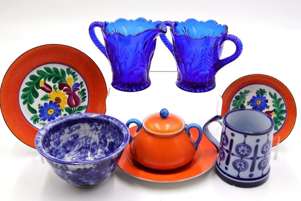 Collection of Vintage Orange and Blue Dishes: Small stoneware bowl, Nordic hand painted mug, Kikusui sugar pot, Phoenix China hand painted plates, and cobalt blue glass thistle cream and sugar set