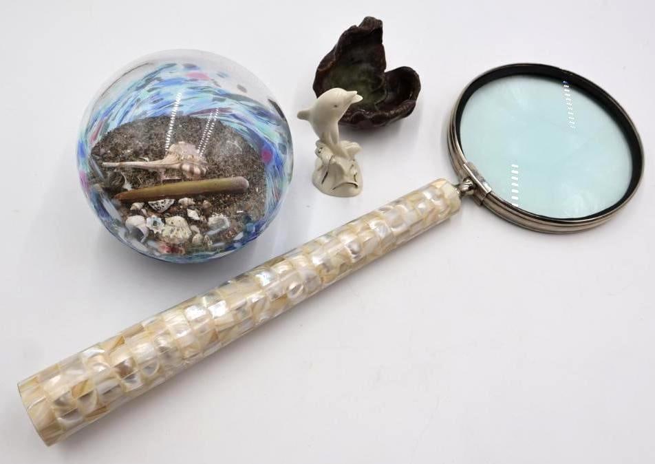 Extra Large Mother of Pearl Magnifying Glass and Nautical Decor: Unique extra long almost 19" magnifying glass with mother of pearl handle, artisan glass float with sand and shells inside marked Edge Art Gallery on bottom, Lenox dolphin statue, and rough clam