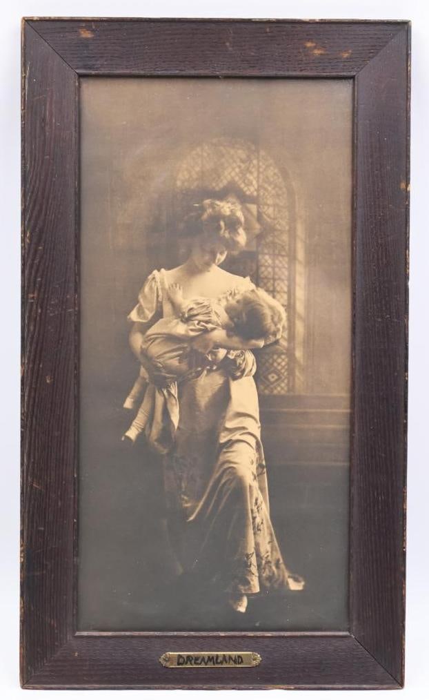 Antique Framed Print 'Dreamland': Dreamland print originating from 1907 by L.M. Henry sepia tone lady holding child, approx. 23.5" by 13.5"