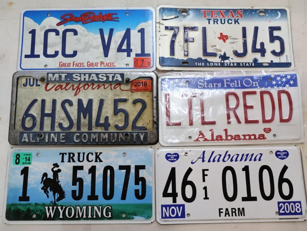 Various State License Plates: South Dakota Texas Truck, Wyoming Truck plate, Alabama farm plate, California, and 'Lil Redd' Alabama vanity plate
