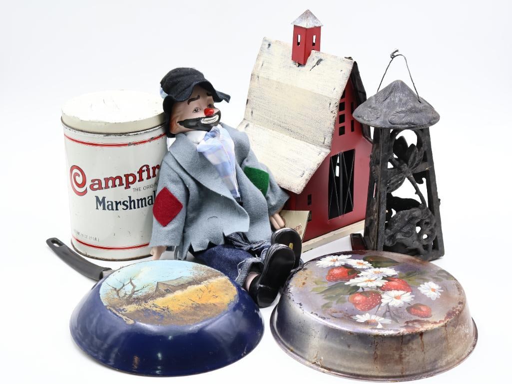 Country Kitchen Decor: Painted pans, cast iron outdoor candle holder, Dream Dolls Hobo Clown doll, modern metal barn decor, and Campfire Marshmallow tin filled with crayons