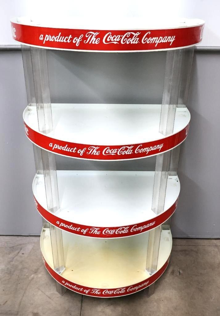 Plastic Four Tier Coca-Cola Stand: Half round showoof I, Paul Flum Ideas Inc. Easily broken down, four tier shelf with clear plastic supports. Measures approx. 53" by 31" by 19"