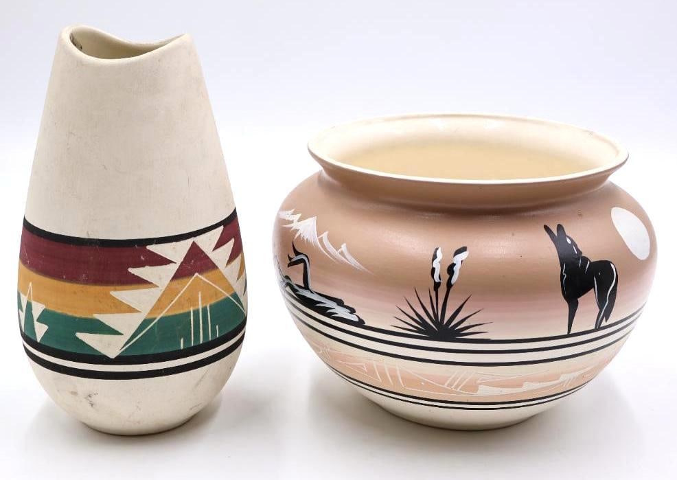 Two Native Pottery Pieces: Sioux Pottery vase with tag on inside and etched signature on bottom, and Lyn Navajo pot with howling coyote (crack on bottom please see all photos)