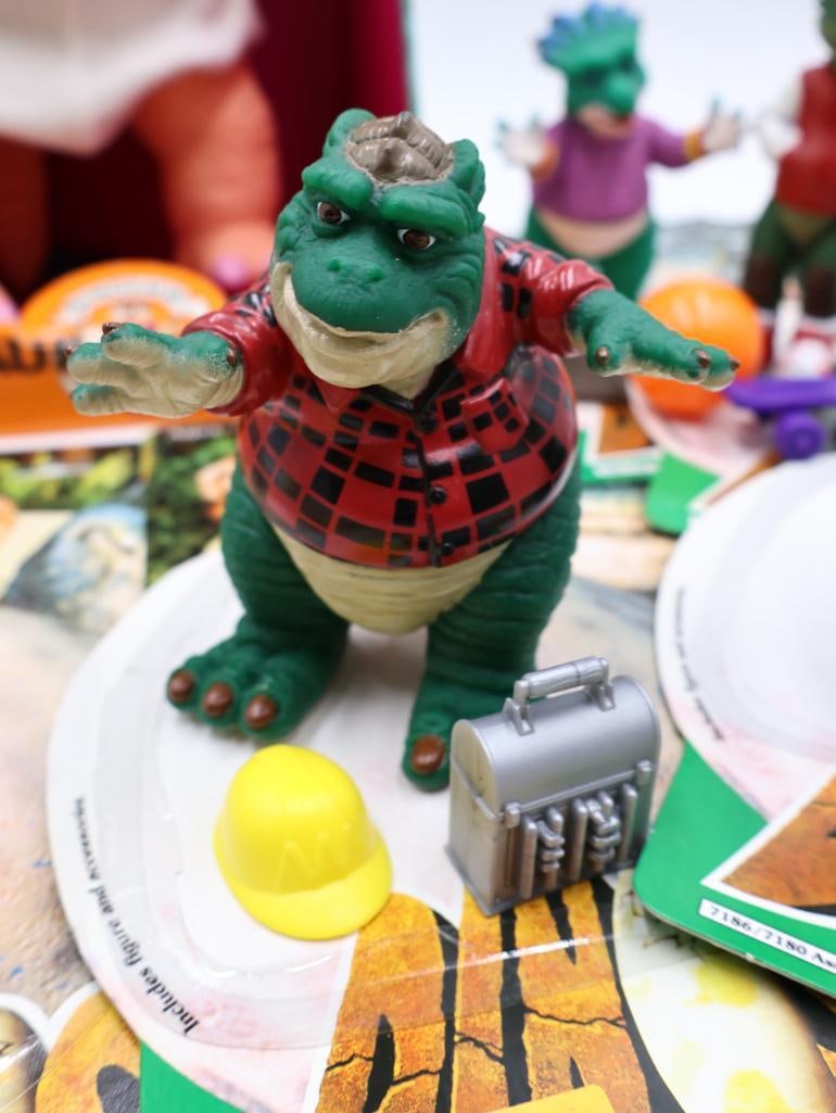 Collection of Toys from the TV Show 'Dinosaurs' - 5