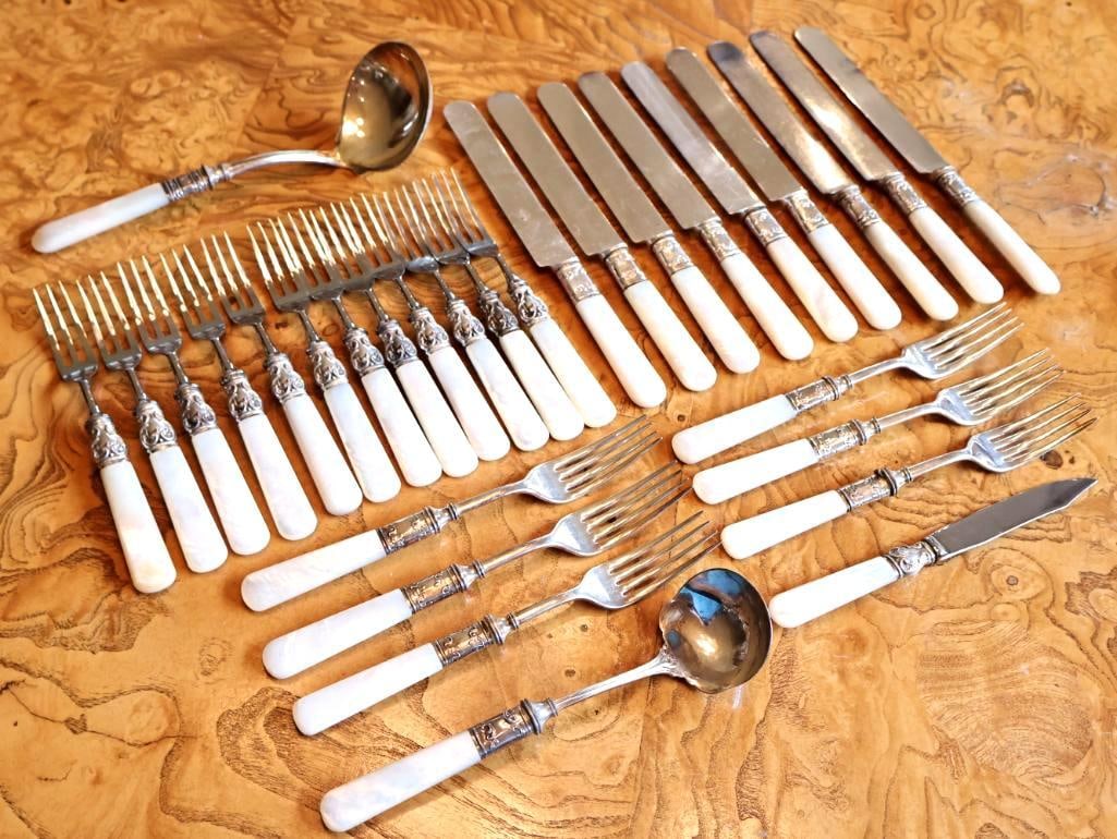 Antique Mother-of-Pearl Handled Flatware & Serving Utensil Collection: Sterling Silver Detail: The decorative metal ferrules/collars connecting the mother-of-pearl handles to the utensils are stamped STERLING. Beautiful collection of antique flatware featuring genuine mo