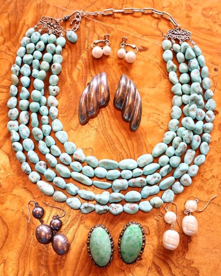 Turquoise and Pearl Jewelry Collection, Necklaces and Earrings: Assorted vintage jewelry lot featuring, two multi strand turquoise nugget bead necklaces with decorative metal clasps, two pairs of oval green colored stone clip-on earrings, sculptural silver-tone