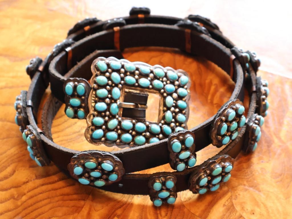 Vintage Navajo George Jones Sterling Silver Concho Bench Belt, 42 in.: Vintage sterling silver concho bench belt attributed to George Jones, featuring a series of handcrafted silver conchos mounted on a leather belt with coordinating sterling silver buckle. Traditional