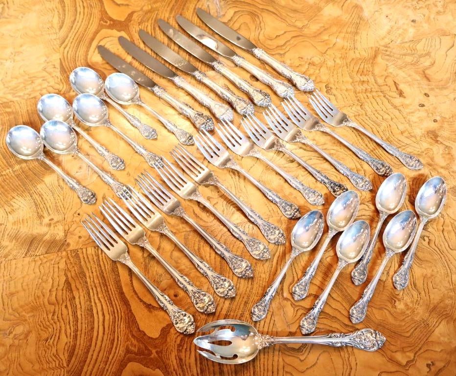 31 Pc Gorham Sterling Silver Flatware Set with Serving Piece: 31-piece Gorham sterling silver flatware collection featuring an ornate floral and scroll pattern. Includes assorted forks, spoons, knives and a large pierced serving piece as shown. Flatware is marke