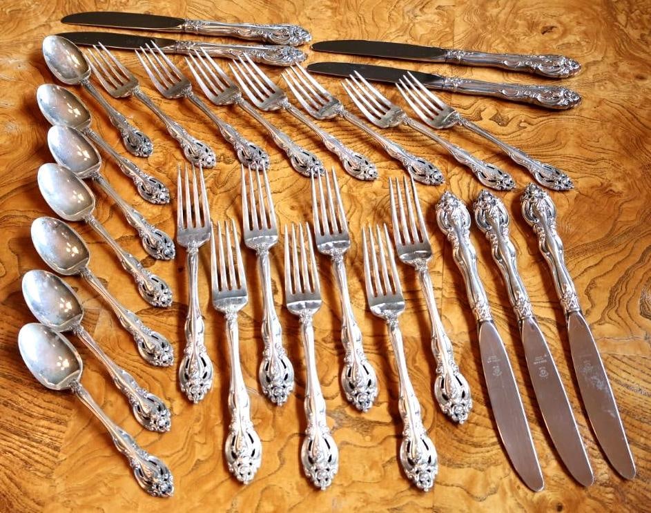 28 Pc Moreau La Salle Sterling Silver Flatware Set: 28-piece sterling silver flatware group by Moreau in the ornate La Salle pattern. Pieces feature elaborate scroll and floral decoration and are marked MOREAU STERLING with the La Salle pattern name. F
