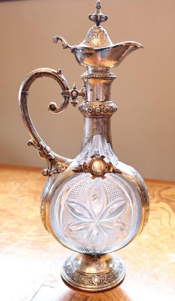 Antique H & C 800 Silver Mounted Cut Glass Figural Ewer / Claret Jug: Impressive antique cut-glass ewer or claret jug with elaborate 800 silver mounts, marked H & C 800 M. Features a large round cut-glass body with deeply cut floral and geometric decoration, ornate