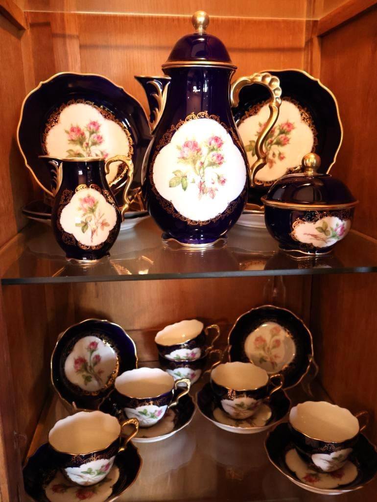 Schumann Arzberg Bavaria Echt Cobalt Moosrose Porcelain Coffee Service: Lot includes the covered coffee pot, creamer, cups, saucers/plates, and additional serving pieces as pictured. Undersides are marked Schumann Arzberg Bavaria, Made in Germany, Echt Cobalt, Moosrose,