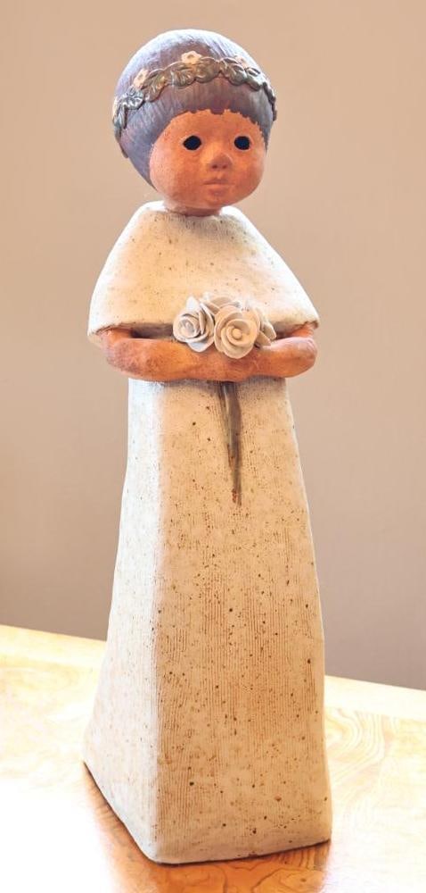 Signed Studio Pottery Ceramic Woman with Flowers Sculpture: Large 22" tall handmade studio pottery sculpture depicting a stylized woman in a long cream-colored dress holding applied ceramic roses. Impressed makers mark near the base appears to read Uoa Ezra.