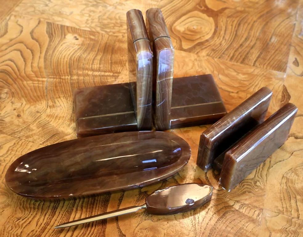 Vintage Karstadt Banded Onyx Desk Set: Coordinating 5-piece vintage desk set crafted from polished brown banded stone, likely onyx or calcite, with original Karstadt retail labels present. Set includes a pair of bookends, letter holder, le