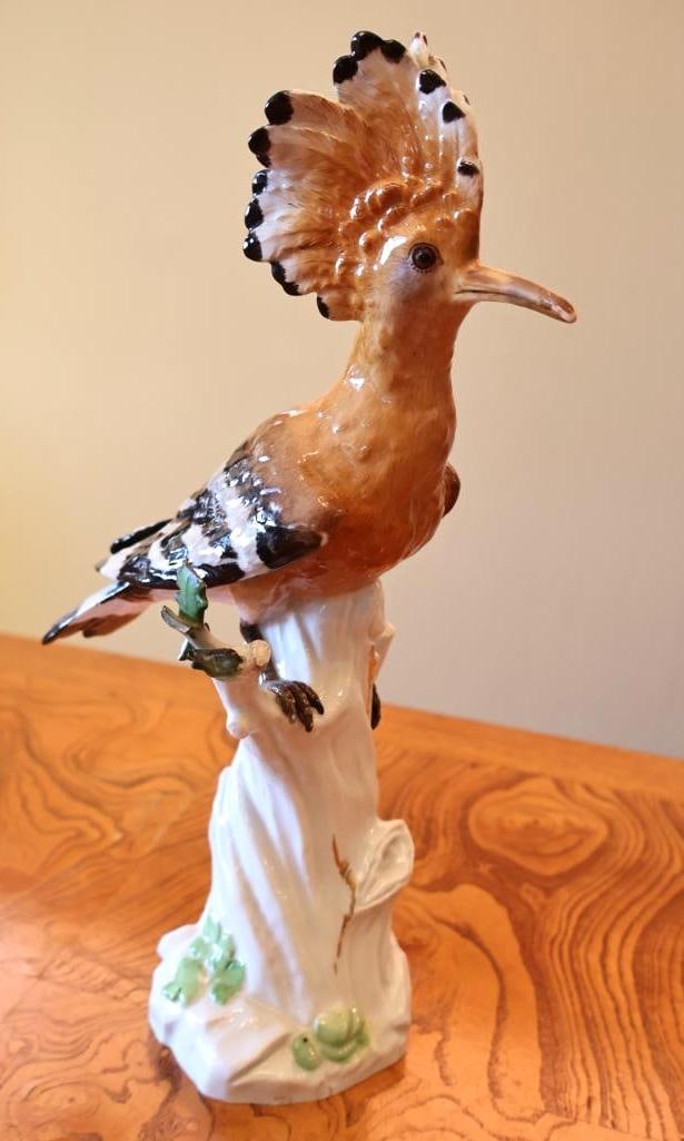 Meissen Hand-Painted Porcelain Hoopoe Bird Figurine: Hand-painted in warm ochre, brown, black and white with an impressive raised feather crest and finely detailed plumage. Underside bears the Meissen crossed-swords mark. Good antique/vintage condition