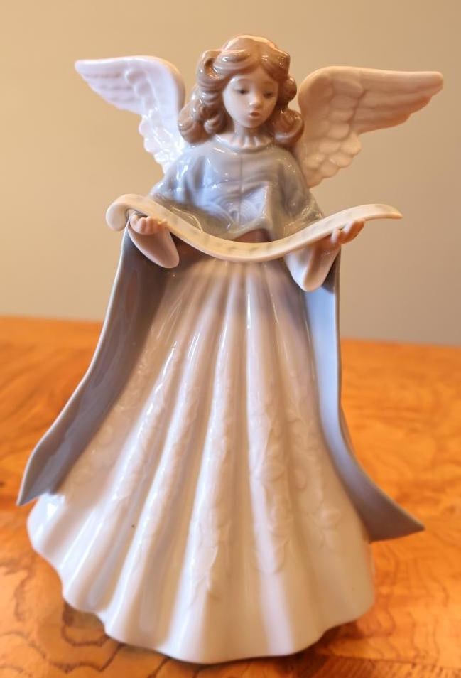 Lladro Porcelain Angel with Scroll Figurine Handmade in Spain: Blue Lladro Hand Made in Spain makers mark to underside. Elegant Lladro porcelain angel figurine depicting a winged angel holding and reading from a flowing scroll. Please review photos carefully for