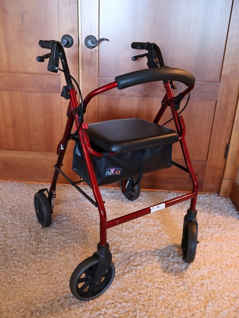 Red Nova Four Wheel Walker: Folds and Includes seat with storage