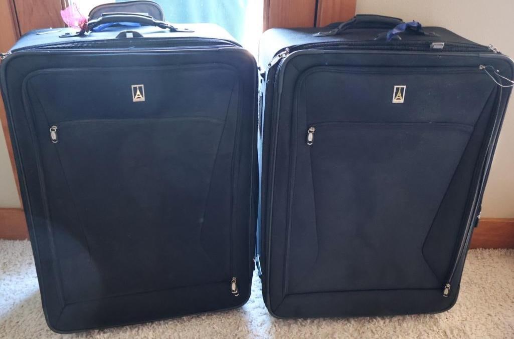 Two Large Suitcases: Includes two colorful toiletry/makeup bags