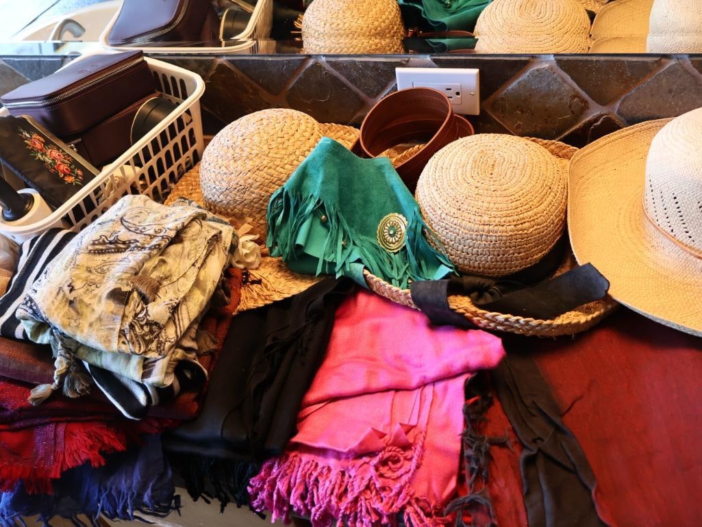 Collection of Hats, Scarves, and Closet Essentials: Three straw style hats, Ellen Tracy belt, turquoise leather fringe collar, jewelry cases, tights, and large collection of scarves/pashmina style accessories