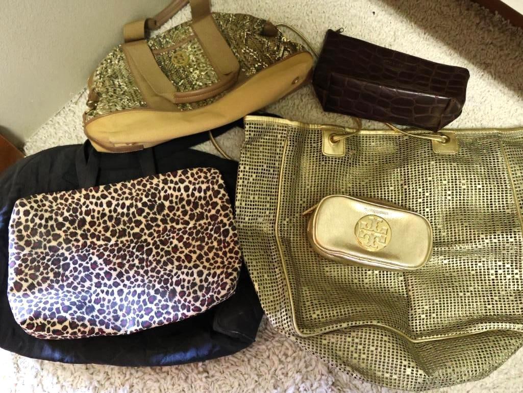 Collection of Bags and Totes including Tory Burch: Tory Burch metallic gold cosmetic pouch, gold mesh tote, estee lauder pouch, leopard print makeup bag, Sonia Rykiel Paris bag, and Tory Burch large zippered medium tote