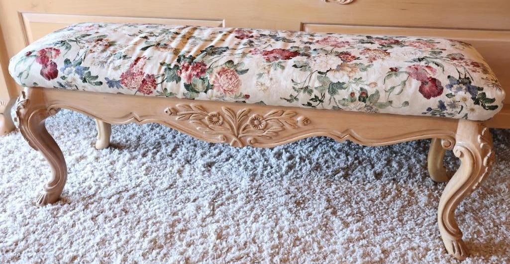 Floral Cushion Bench with Light Wood Carved Accents: French Provincial style floral carved light wood bench with multi colored flowers on cream cushion, about 46" long by 15" by 18"