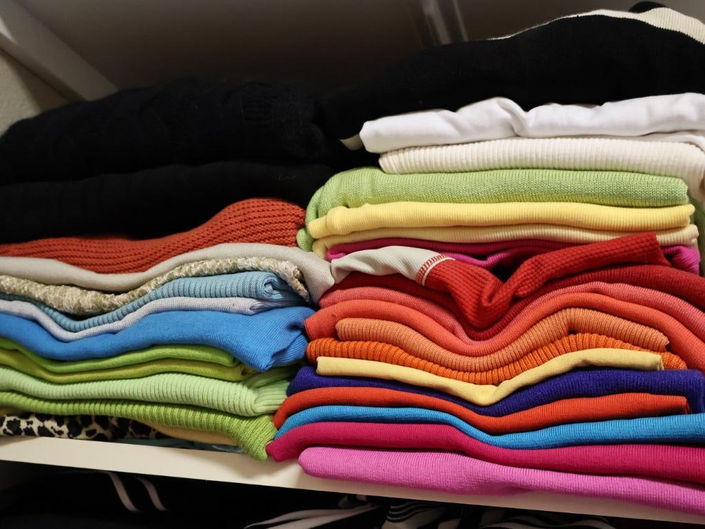 Two Stacks of Pull Over Sweaters (1 of 6)