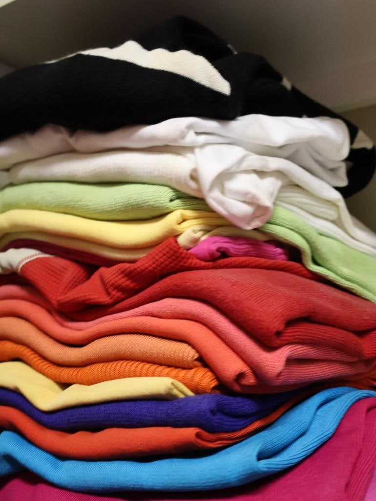 Two Stacks of Pull Over Sweaters - 2