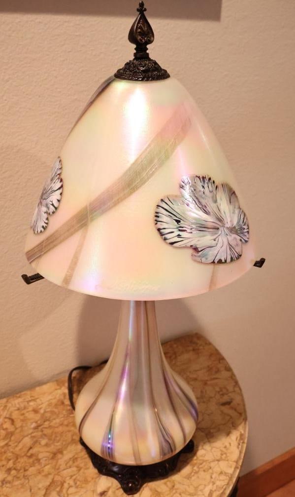 Quoizel Iridescent Art Glass Floral Table Lamp by Todd Phillips: Elegant Quoizel table lamp featuring a pearlescent iridescent art-glass body and coordinating bell-form glass shade designed and signed by artist Todd Phillips. Approximately 2122" tall overall.