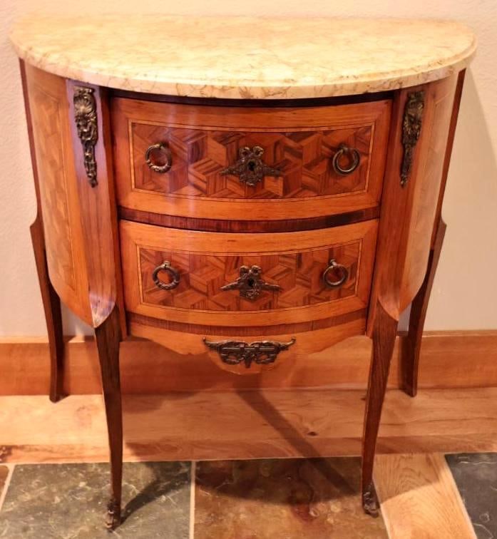 Antique French Louis XV-Style Marble-Top Demilune Two-Drawer Commode: Lovely condition marble topped two drawer half-moon side table with lovely geometric cube parquetry inlay. Brass accents adorn the front feet and along edges of the table and dovetail drawers. Tag on