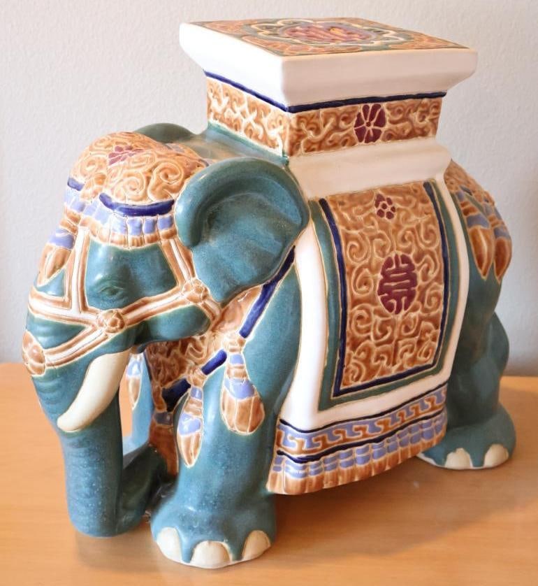 Ornate Elephant Ceramic Stand: stands about 1.5 ft tall, featuring teal glazed elephant with golden yellow accents