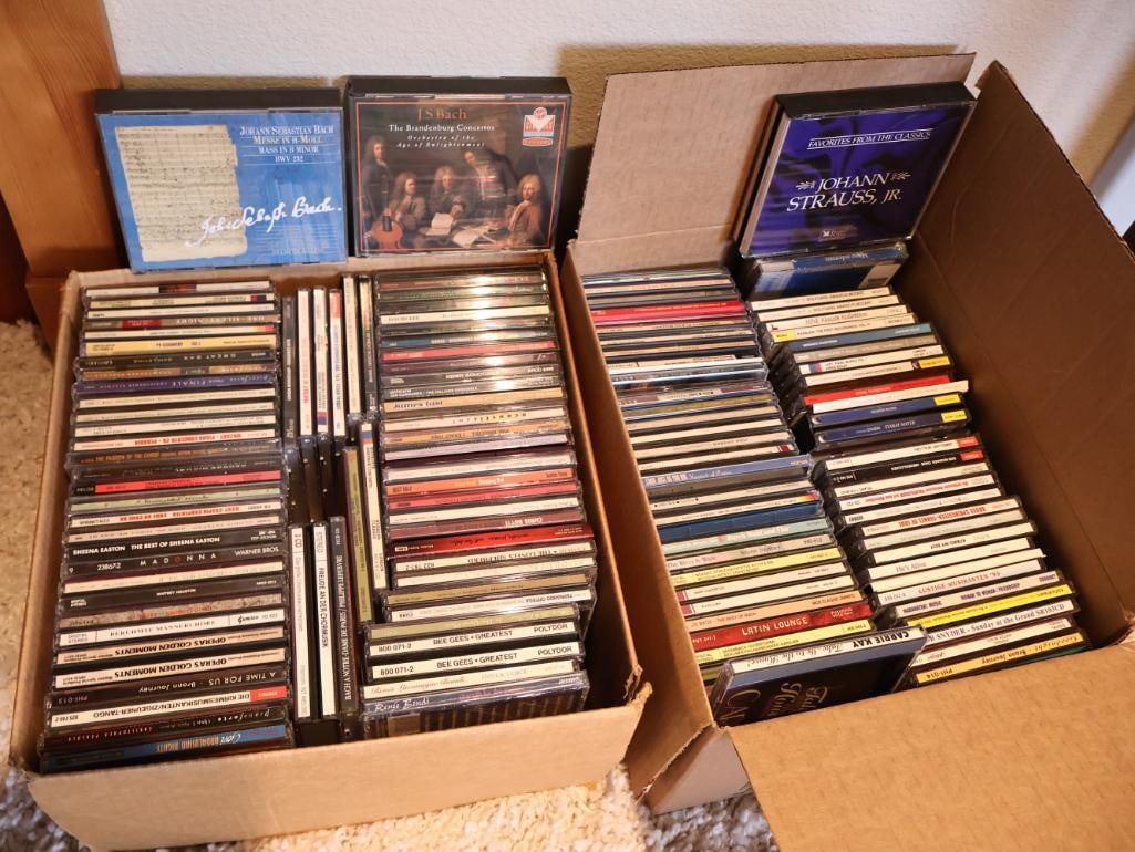 Two Boxes full of CDs: Includes majority of classical music and multi disc sets, with favorites like Madonna, Gloria Estefan, Bee Gees, and more