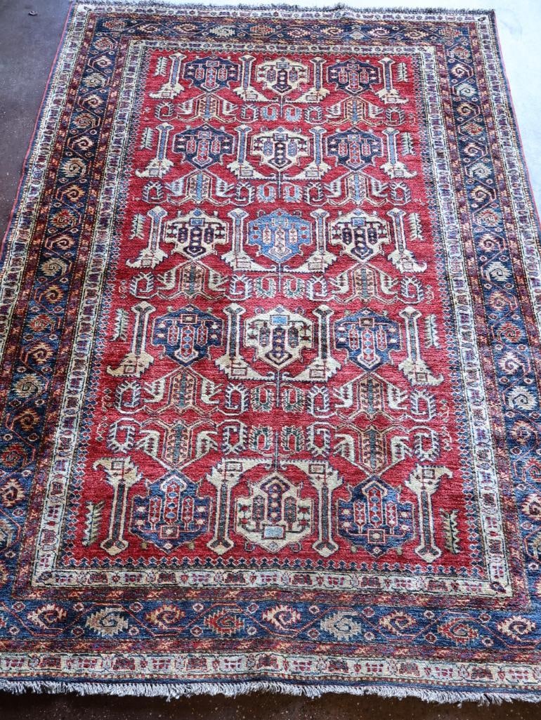 Vintage Persian Style Hand Knotted Rug: This tribal design rug features red and blue hues set against a cream color