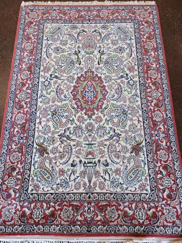 Vintage Wool and Silk Woven Persian Area Rug: Gorgeous Isfahan style rug, where the intricate highlights outlining the birds and flowers are typically woven with pure silk to reflect light and contrast against a matte wool pile. It features a