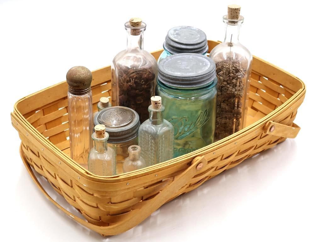 1979 Longaberger Basket with Antique Apothecary and Ball Jars: Handwoven Longaberger Basket, Dresden, Ohio, USA, hand-dated 1979, filled with an appealing collection of antique and vintage glass bottles and jars. Includes aqua Ball canning jars with zinc lids,