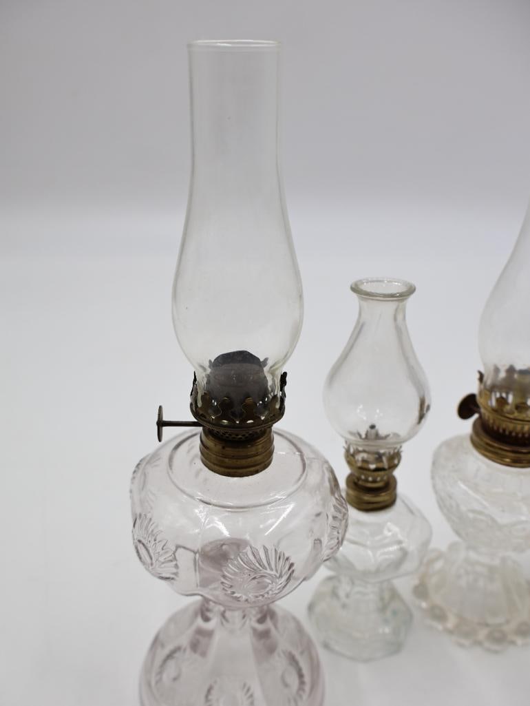 Collection of 7 Antique Clear Glass Kerosene Oil Lamps - 7