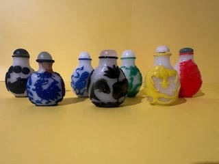 Antique Chinese Peking Glass Snuff Bottle: Antique Chinese Peking glass snuff bottles are highly collectible art objects. Seven Chinese peiking glasses bottles