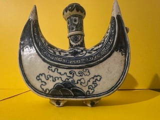 Pouring vessel, Chinese Ming Dynasty (Hongzhi-zhengde) period: Unglazed base. Pouring vessel in the shape of a cresent with feet and a spour. Size H: 8.5&rdquo; W: 8.5&rdquo;