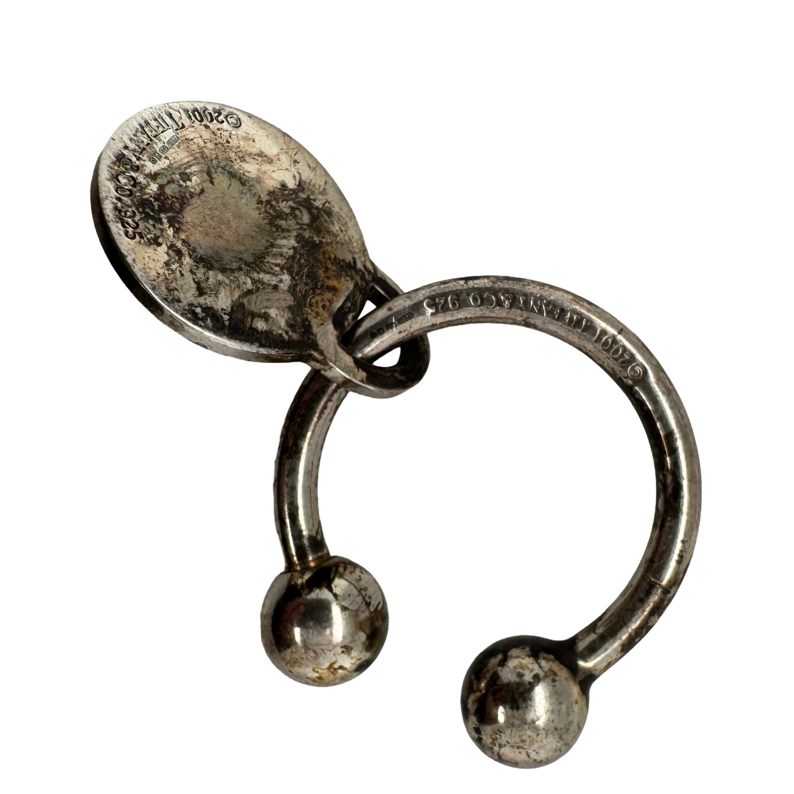 Tiffany & Co. Fleur-de-Lis Engraved Sterling Silver Key Chain, 20.4g, 2001: Tiffany & Co. Fleur-de-Lis Engraved Sterling Silver Key Chain Description: A stylish and collectible Tiffany & Co. sterling silver key chain featuring an engraved fleur-de-lis motif. This clas
